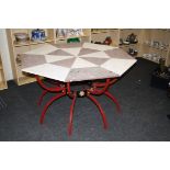 A craftsman made sample marble octagonal table, with wrought iron base, 131cm