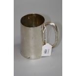 A silver pint tankard, tapering cylindrical, with hollow 'C; shaped handle, 11cm, 11oz high