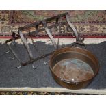 A wrought iron rustic pan rack, together with a copper jam pan