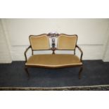 An Edwardian carved and pierced salon settee with cabriole supports, 119cm wide