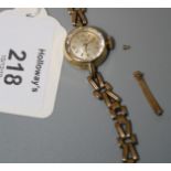 A lady's 9ct gold Rotary wristwatch, the circular champagne dial with baton numerals, fancy link 9ct
