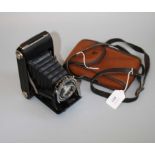 A Voightlander Sport folding camera, with outer case