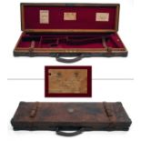 JAMES PURDEY & SONS A BRASS-CORNERED OAK AND LEATHER SINGLE GUNCASE, fitted for 30in. barrels, the