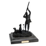 HOLLAND & HOLLAND A BRONZE SCULPTURE OF SHOOTER ON PEG WITH LABRADOR RETRIEVERS, measuring approx. 7