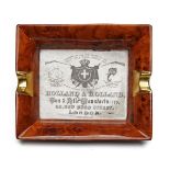 A HOLLAND & HOLLAND CIGAR ASHTRAY, measuring approx. 7 1/4in. x 6 1/8in., with central Holland &