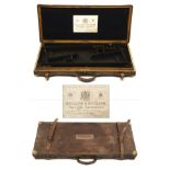 HOLLAND & HOLLAND A BRASS-CORNERED OAK AND LEATHER DOUBLE GUNCASE, fitted for 28in. barrels, the