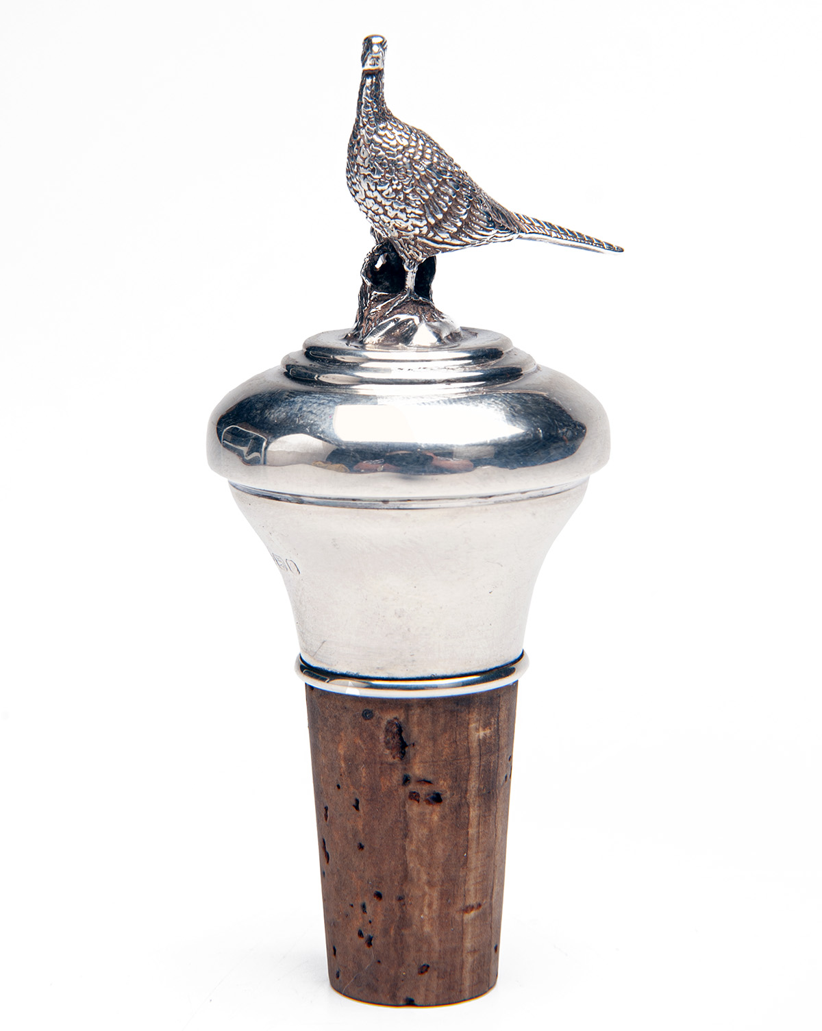 A SILVER-TOPPED CORK BOTTLE STOPPER, Birmingham 925 silver hallmarks, makers stamp 'L.R.W.', the top