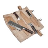 A COMPREHENSIVE SET OF CHEF'S KNIVES CONTAINED WITHIN A LEATHER ROLL, with a full assortment of
