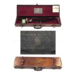 A BRASS-CORNERED LEATHER SINGLE GUNCASE, fitted for 30in. barrels, the interior lined with red