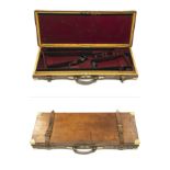 A BRASS-CORNERED OAK AND LEATHER DOUBLE GUNCASE, fitted for 30in. barrels, the interior lined with