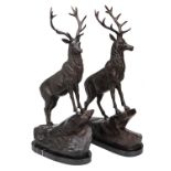 A PAIR OF BRONZE STAGS SIGNED BY T. MAIGNIERY, each standing on a rocky prominence and mounted on
