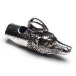 A STERLING SILVER DOG WHISTLE, marked 'STERLING', with lanyard ring