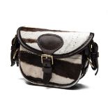 A ZEBRA HIDE AND LEATHER SMALL CARTRIDGE BAG, with canvas and leather shoulder strap and brass