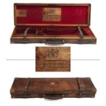 STEPHEN GRANT A BRASS-CORNERED OAK AND LEATHER SINGLE GUNCASE, fitted for 30in. barrels, the