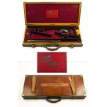 COGSWELL & HARRISON LTD. - A BRASS-CORNERED OAK AND LEATHER DOUBLE GUNCASE