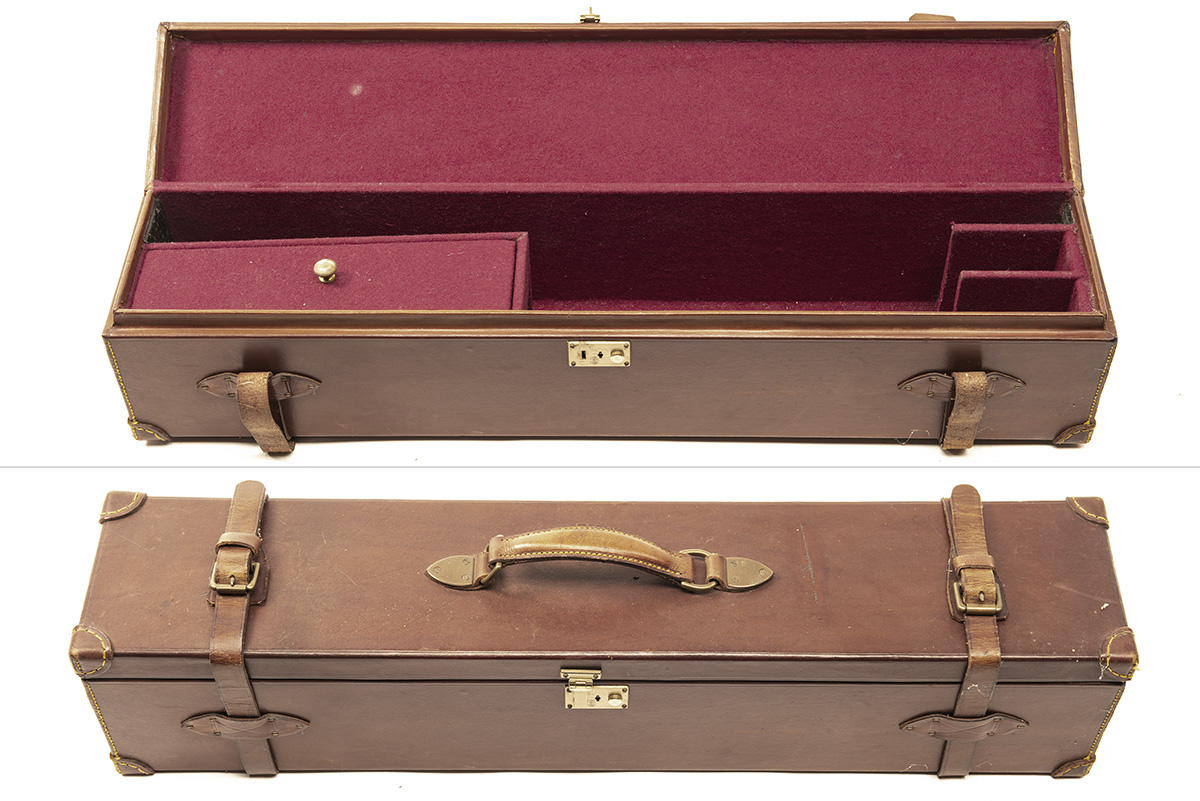 A LEATHER DOUBLE MOTOR GUN CASE, fitted for 30in. barrels, the interior lined with maroon baize,