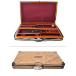 GUARDIAN LEATHER A NEW AND UNUSED BRASS-CORNERED OAK AND LEATHER PRESENTATION DOUBLE GUNCASE, fitted