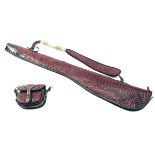 AN UNUSED CROCODILE SKIN FLEECE-LINED SINGLE GUNSLIP WITH MATCHING CARTRIDGE BAG, the slip with