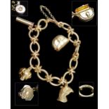 JAMES PURDEY & SONS A FINE 18CT. GOLD CHARM BRACELET, Birmingham hallmarked at 750 and with makers