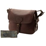 JAMES PURDEY & SONS A LEATHER CARTRIDGE BAG, with canvas and leather shoulder strap, brass fittings.