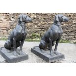 A PAIR OF CAST STEEL LIFE SIZE SEATED EUROPEAN STYLE HOUNDS, measuring approx. 30in. x 26in. x