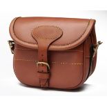 FREDERICK BEESLEY A NEW AND UNUSED TAN LEATHER SUEDE-LINED SMALL CARTRIDGE BAG, with canvas and