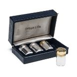 TIFFANY & CO. A SET OF FOUR STERLING SILVER SALT AND PEPPER MINATURE POTS IN THE FORM OF CARTRIDGES,