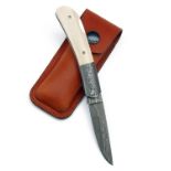 JAMES PURDEY AND SONS A FINE NEW AND UNUSED DAMASCUS STEEL AND MAMMOTH TUSK FOLDING KNIFE, with 2