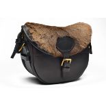 A GAME FUR AND LEATHER SUEDE-LINED CARTRIDGE BAG, with canvas and leather shoulder strap and brass