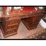 Antique oak pedestal desk with nine drawers to the