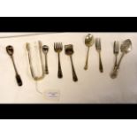 Silver sugar tongs, teaspoons, etc.