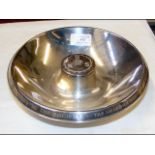 A silver presentation dish with central boss, Spin