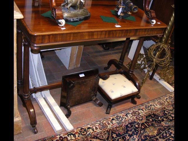 A Victorian mahogany stretcher table