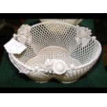 A Belleek weave basket - 16cm diameter