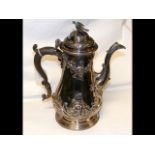 A Georgian silver teapot - bottom engraved 1756 -