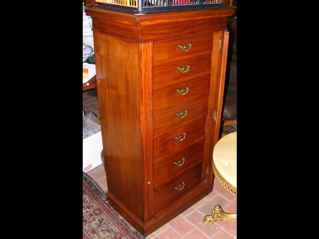 An antique mahogany seven drawer Wellington chest