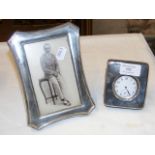 A silver photo frame with easel mount, together wi