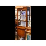 Inlaid Edwardian display cabinet with bowed cupboa