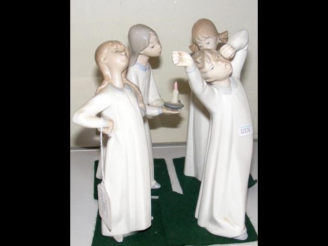 Four Lladro figures "Sleepy Boy" and other