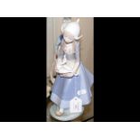 Lladro figure of girl carrying duck 26cm