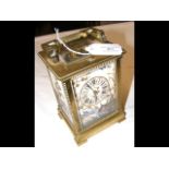 A brass cased repeater carriage clock with painted
