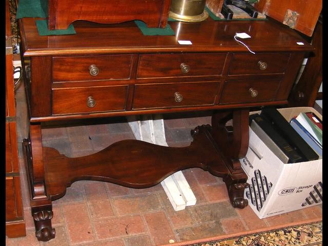 A 19th century mahogany side table with six drawers