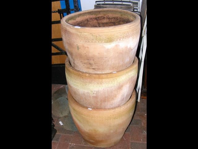 A set of three decorative large garden pots