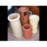Old terracotta chimney pot, together with three others