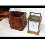 A brass cased carriage clock with travelling case