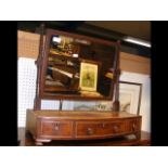 Antique toilet mirror with three drawers to the ba