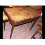 An antique fold-over games table