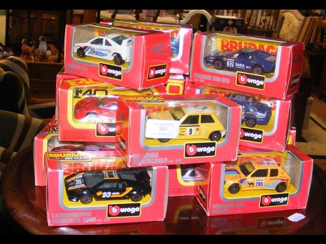 Selection of boxed Burago die-cast racing cars