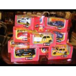 Selection of boxed Burago die-cast racing cars
