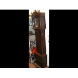 An antique oak eight day Grandfather clock with separate